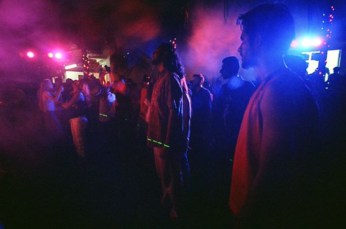 The Crowd at an event with athmosphere, lights and lasers.