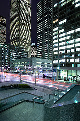 streaks of differently coloured light in the middle of a city
