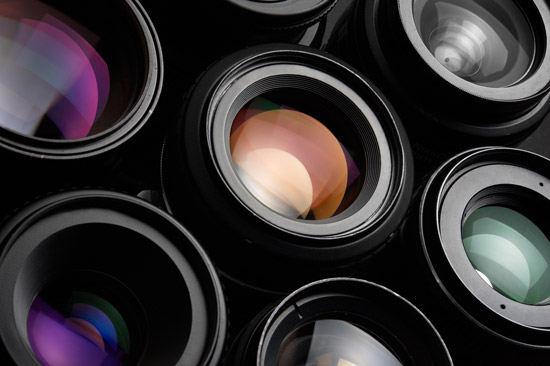 A number of camera lenses being exposed to light