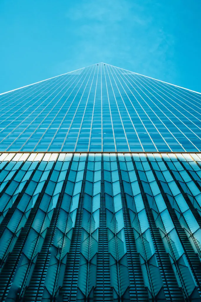 A photograph of a skyscraper in one point perspective.