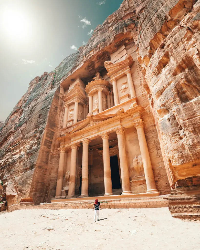 An architectural photograph of a rock face carving in Petra, Jordan. 