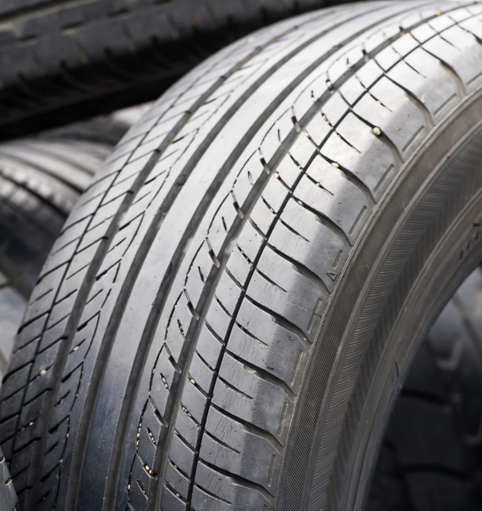 Close up old tires with whitened surface and cracks