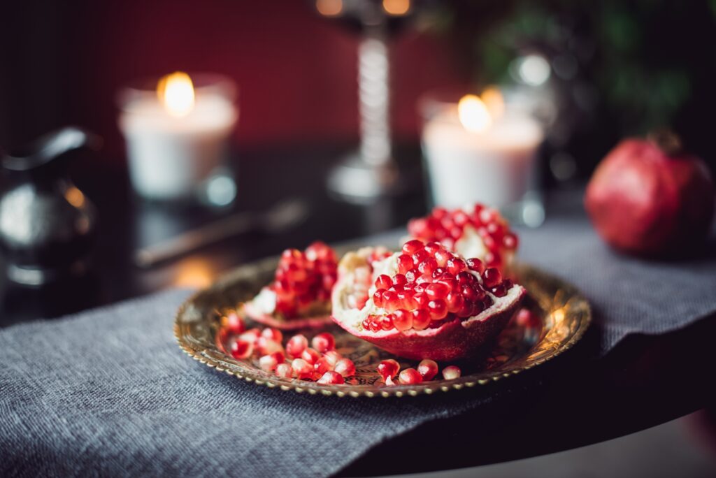 A still-life composition with pomegranate on a copper plate