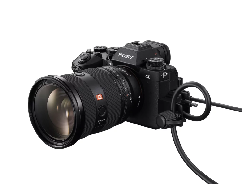 Sony A9 iii product photograph front angle view, with attached HDMI cable
